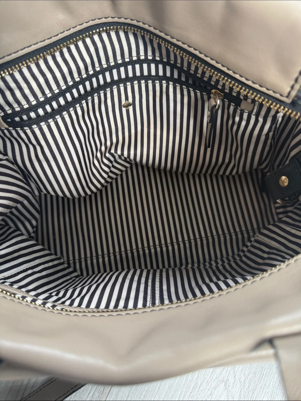kate spade Taupe and Black Leather Satchel with Front Emblem